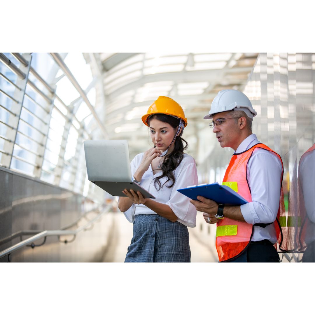 Data center engineers walking through server racks, representing mission-critical operations workforce.