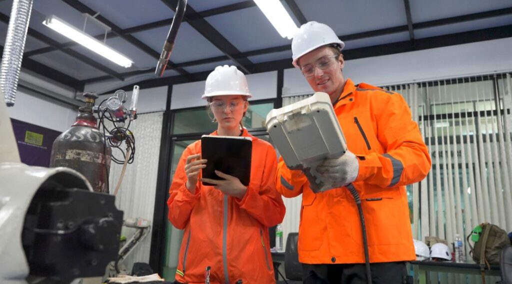 ngineers conducting maintenance on electrical and mechanical systems in a data center.