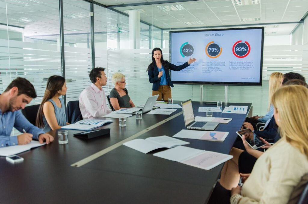 Technology leader presenting operational strategy with digital performance metrics.